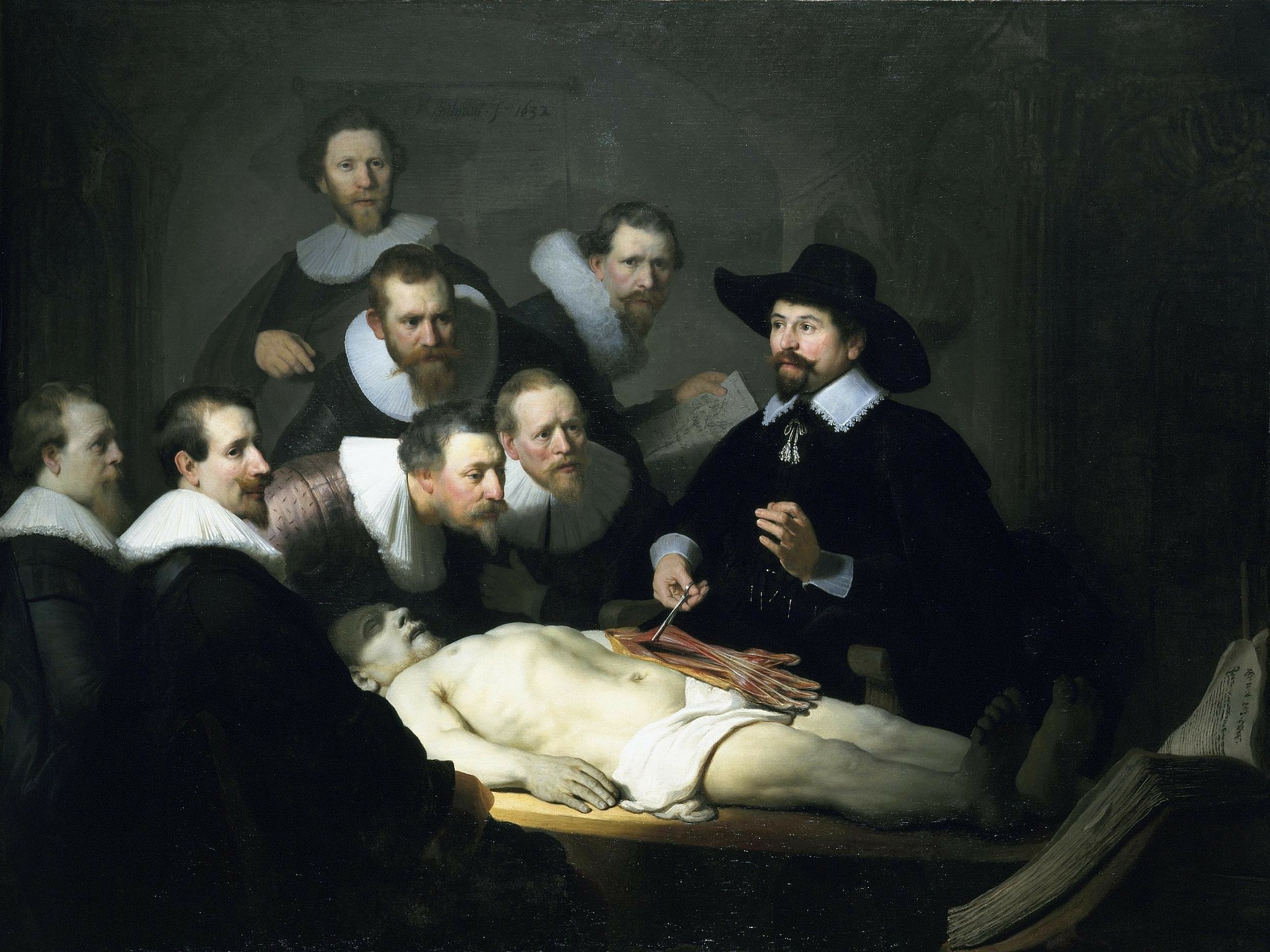 Quadro Aula de Anatomia de Rembrandt. Descrição: Professor disseca corpo cercado por alunos. Todos são homens com roupas características da Holanda do início do século 17.